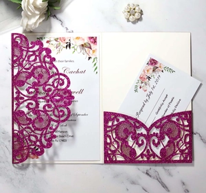Detail of laser-cut glitter wedding invitation with elegant floral print and RSVP card