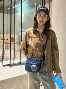 Vintage blue denim crossbody bag with adjustable strap and flap cover for casual outings