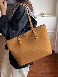 Retro mustard yellow faux leather tote bag for women with gold logo plaque detail