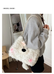 Detail view of white plush shoulder bag with cute animal face and pink blush decor