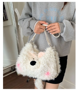 Detail of soft white plush bear shoulder bag with pink ears and leather strap