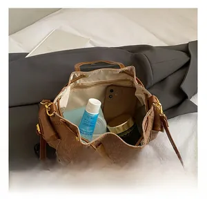 Interior view showing the spacious capacity and drawstring closure of this bucket bag