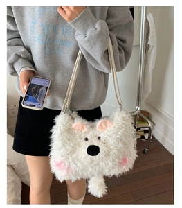 Detail of soft white plush teddy bear shoulder bag with cute pink inner ear accents