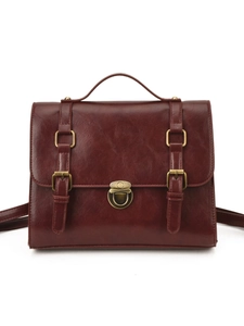 Vintage dark brown faux leather messenger bag with top handle and metal buckles