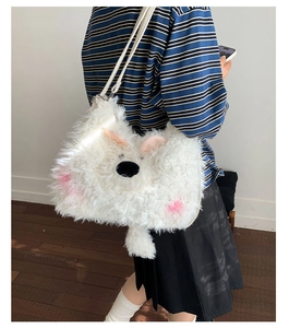 Detail of white fluffy animal-shaped plush shoulder bag with adjustable strap and cute ears