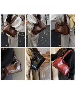 Detail shots of large retro PU leather tote bag with cross-stitch and metal buckles