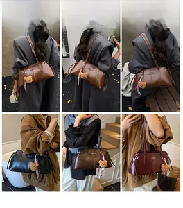 Detail view of stylish leather underarm bags in brown black and burgundy with bear charm