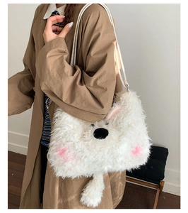 Detail of cute white plush animal crossbody bag with leather strap on model