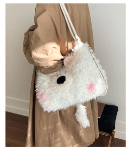 Detail shot of the white plush backpack with cute 3D ears and soft faux fur texture
