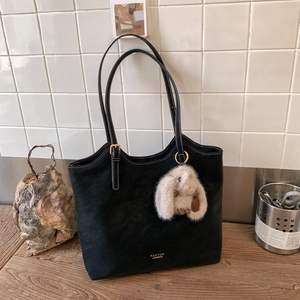Vintage black large capacity tote bag with white stitching and plush bunny charm