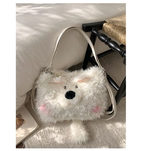 Detail of soft white plush bear bag featuring fluffy texture and creamy leather strap