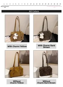 Detail of vintage suede shoulder bags in tan and dark brown with adjustable straps