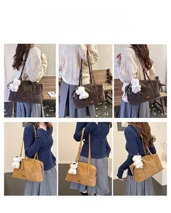 Detail of vintage tote bag showing matte texture and cute plush bear charm detail