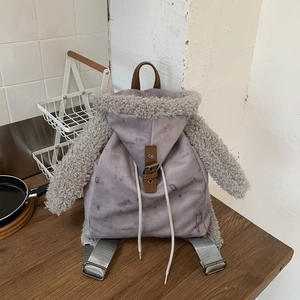 Detail of hoodie-style backpack with faux fur lining and adjustable nylon straps