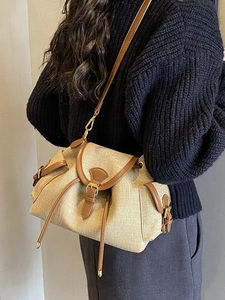 Retro drawstring bucket bag with textured woven wheat fabric and brown leather trim