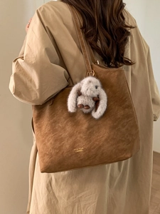 Vintage dark brown suede tote bag with long strap and plush rabbit charm for women