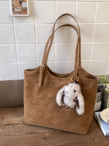 Retro brown suede tote bag with long straps and cute plush bunny charm decoration
