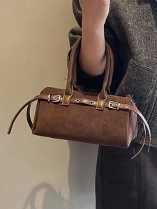 Retro brown suede Boston bag for women featuring stylish metal buckles and sturdy handles