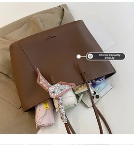 Top view of spacious brown litchi leather tote bag showing large interior capacity