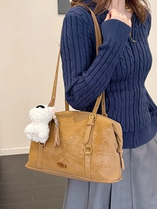 Ginger yellow leather Boston shoulder bag with cute white puppy pendant accessory