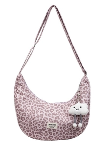 Pink leopard print crescent tote bag with adjustable strap and plush cloud charm