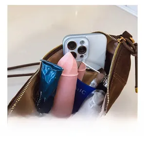 Macro view of brown suede dumpling bag interior showing large capacity for daily items