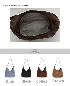 Détail du sac seau en daim montrant le compartiment principal spacieux et la poche zippée