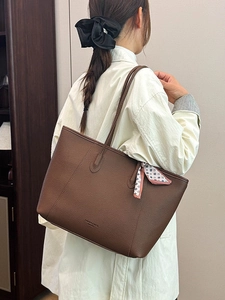 Deep brown textured leather tote bag with decorative scarf and large capacity design