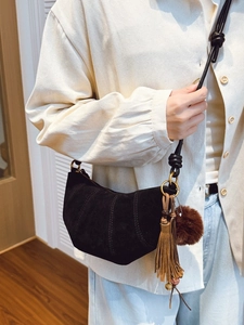 Vintage matte black suede croissant bag with fringes and fur ball accessory