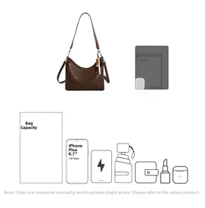 Detail view of brown bucket bag capacity showing items like phone, umbrella and cosmetics