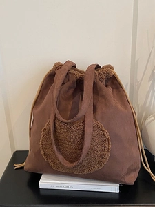 Vintage brown suede bucket bag with plush teddy fleece trim and drawstring closure