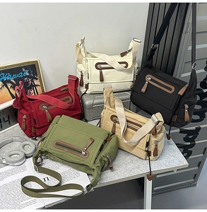 Collection of nylon messenger bags in red, beige, black, green, and khaki colors