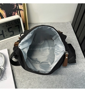 Interior view of the vintage messenger bag showing spacious capacity and grey lining