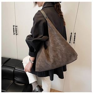 Close-up of vintage coffee brown frosted suede tote bag showing detailed matte texture