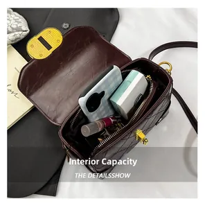 Interior view of quilted crossbody bag showing storage space for phone and makeup