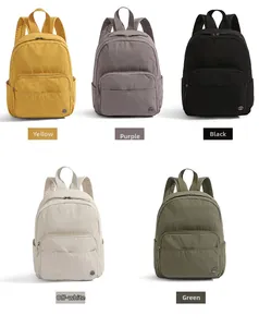 Selection of retro nylon backpacks in yellow, purple, black, cream, and green colors