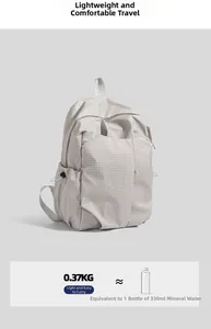 Lightweight grey backpack weighing 0.37kg compared to a 330ml water bottle for scale