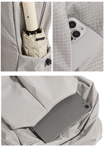 Detail view of grey geometric backpack showing compartments for tablet, phone and umbrella