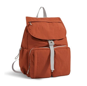Detailed side view of multi-pocket nylon backpack with grey straps and buckle closure