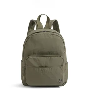 Front view of olive green nylon backpack with front zipper pocket and metal logo detail
