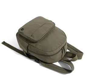 Side view of olive green nylon backpack showing waterproof fabric and sturdy zippers
