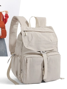 Minimalist beige nylon casual backpack with multi-pocket design and padded shoulder straps