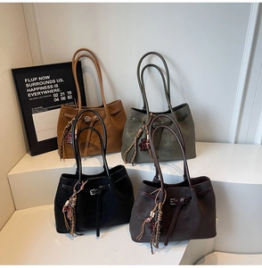 Minimalist leather tote bag collection featuring four elegant colors with stylish beaded charms