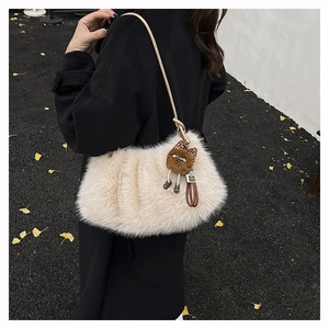 Furry beige crescent shoulder bag with leather strap and cute plush monster charm