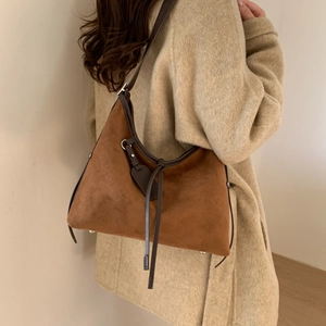 Brown frosted suede shoulder bag shown with beige coat for elegant autumn styling