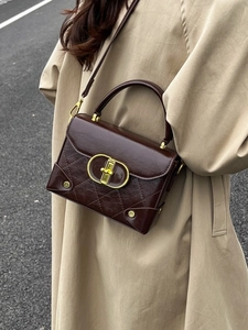 Retro chocolate brown crossbody bag with quilted leather and golden CD buckle detail