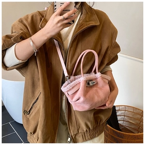 Pink suede tote bag featuring faux fur trim and metallic twist lock for women