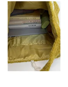 Spacious interior of yellow plush tote bag showing inner pocket and lining detail