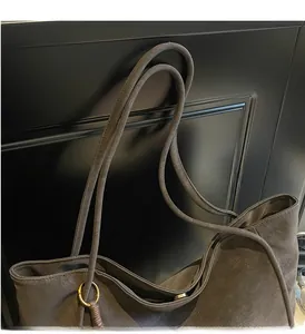 Detail view showing durable thin top handles and high-quality matte faux leather material