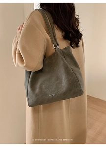 Close-up of dark grey retro leather tote bag with RUISHANG & BAGS lettering detail